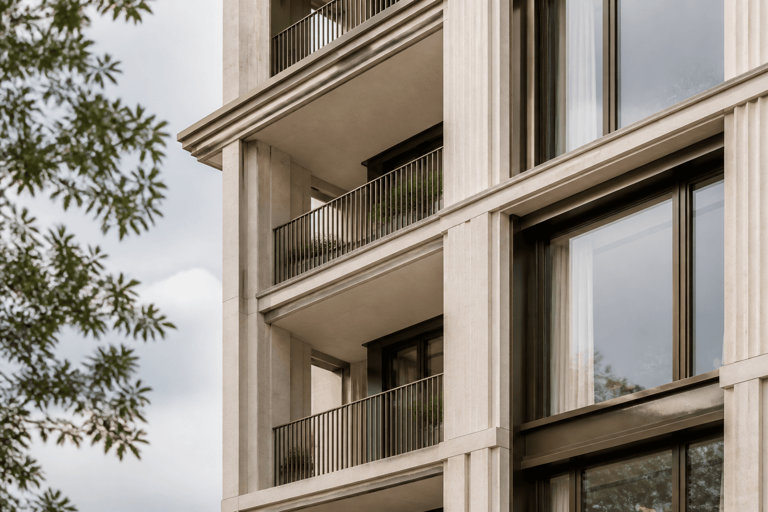 Sculptural modern architecture framed against an open sky